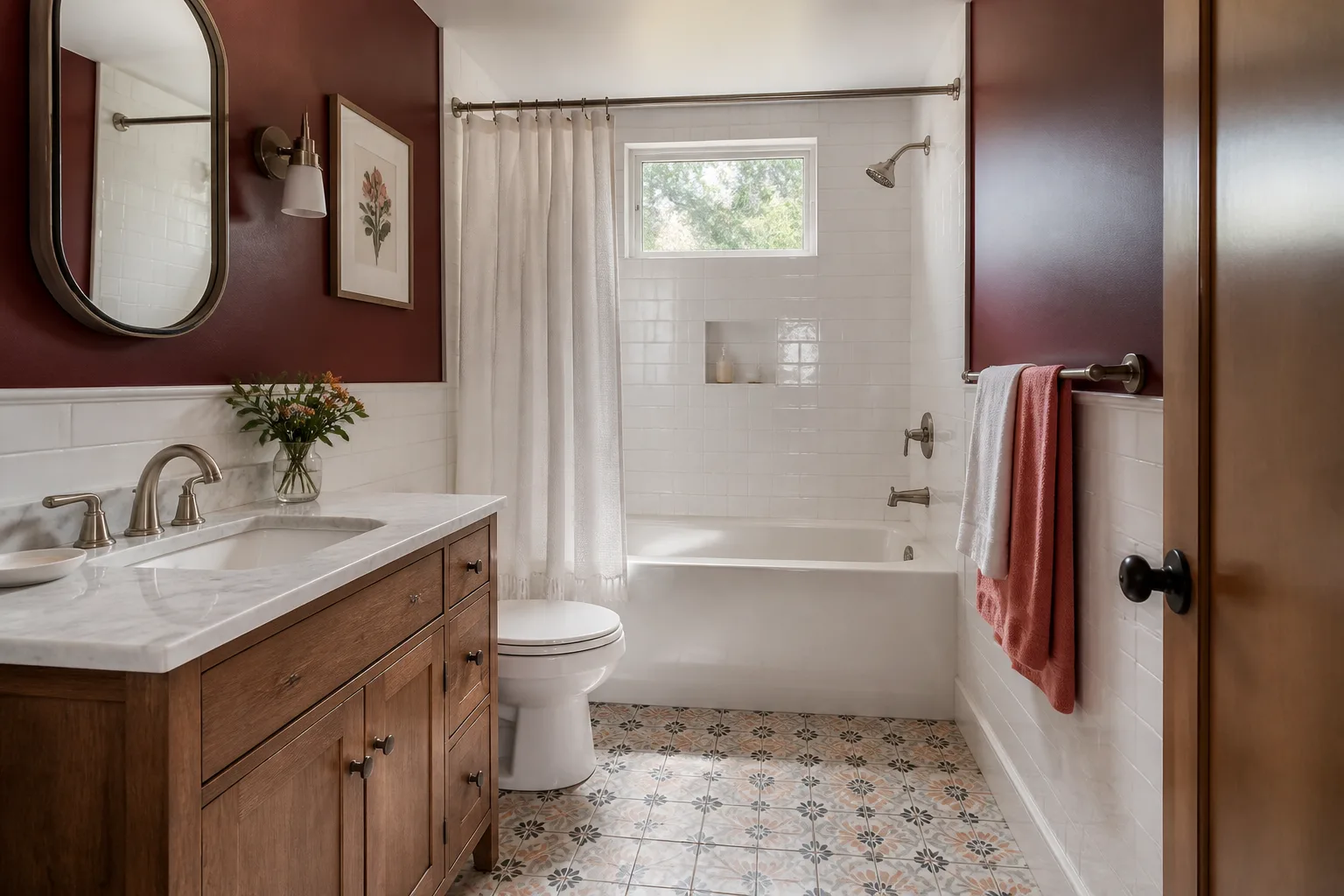 A remodeled hall bathroom with patterned floor tile and painted walls